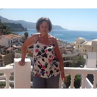 A lady with the sea in the background